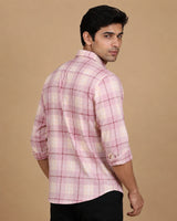 Pink check casual shirt - seated side view